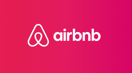 Airbnb logo displayed on a computer screen